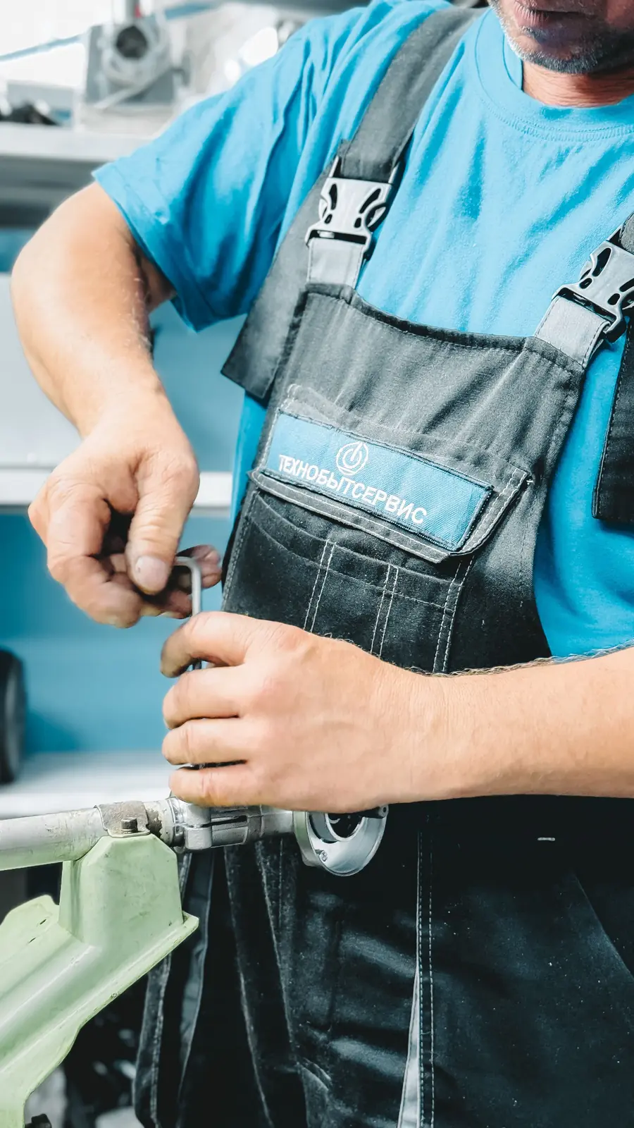 Local Services Ads management: plumber tightening a pipe fitting with a wrench